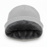 a grey fleece lined winter beanie hat white background